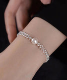 Elegant Silver Beaded Mesh Bracelet with Solitaire Pearl Center